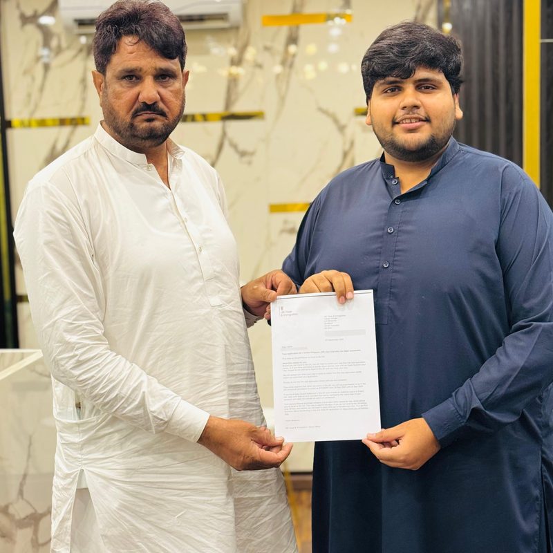 Student with a stamped UK study visa in his passport